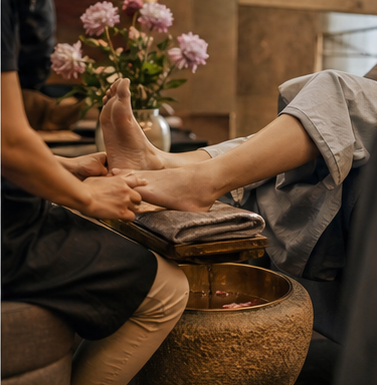 Representative New York foot massage spa with quiet treatment chairs and warm city-spa atmosphere.